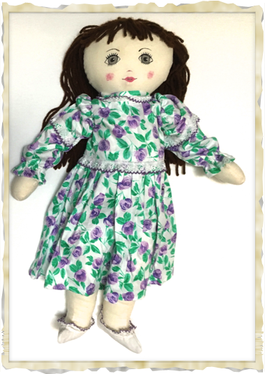 Victoria is modeling a lavender floral dress with white shoes and purple trim. Victoria is modeling a lavender floral dress with white shoes and purple trim.