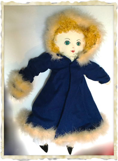 Kitty wearing Winter coat, trimmed with fur and muff. Kitty wearing Winter coat, trimmed with fur and muff.